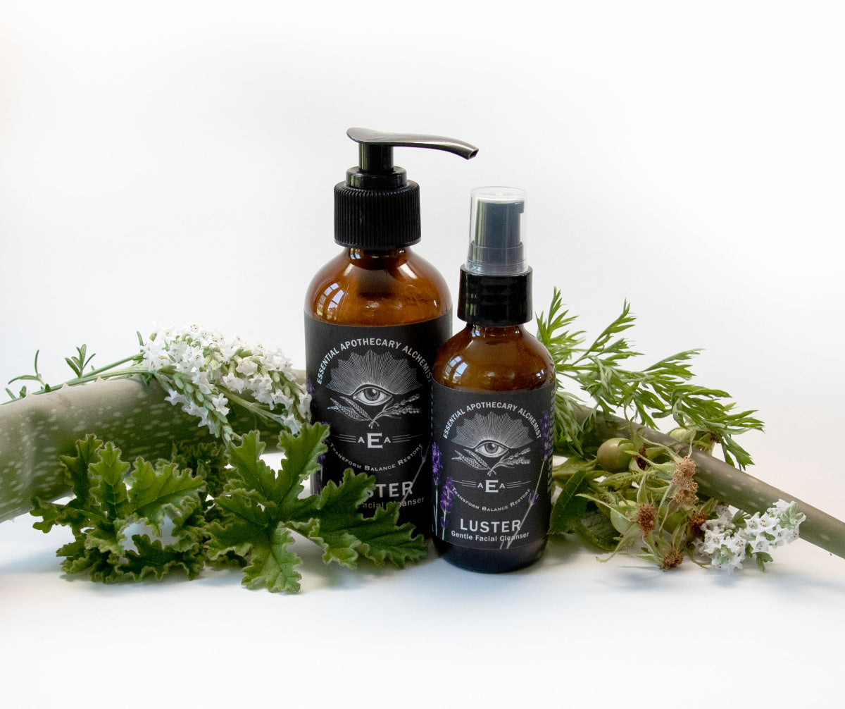 Luster bottles surrounded by their natural botanicals